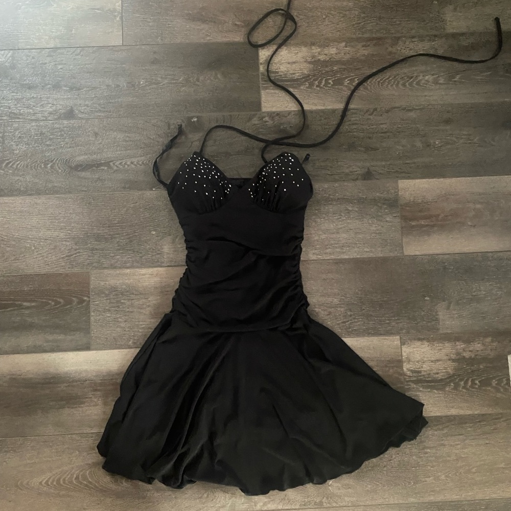 Small black dress with sequins tight at the top loose at the bottom
